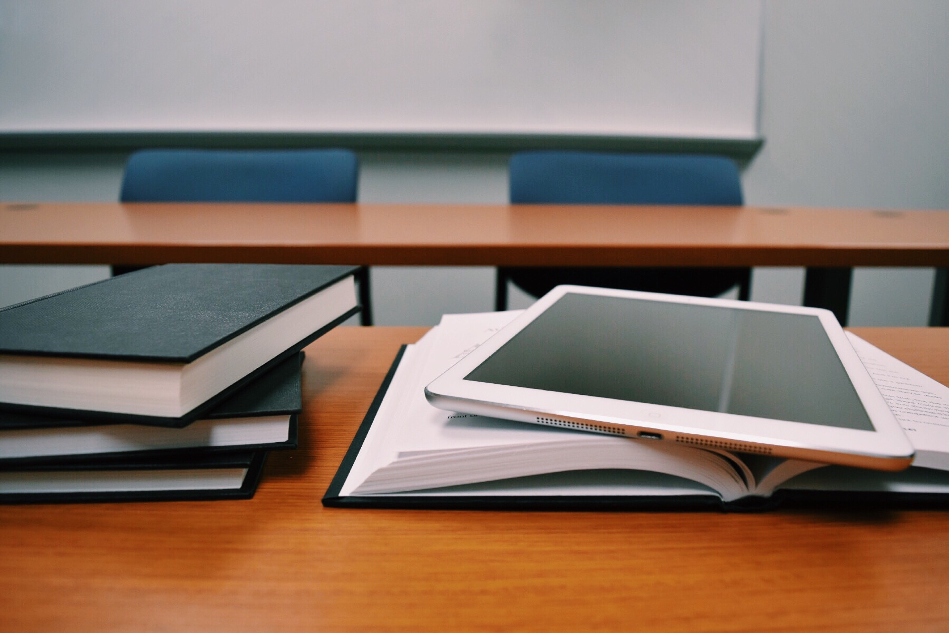 Books, notebooks and a digital tablet